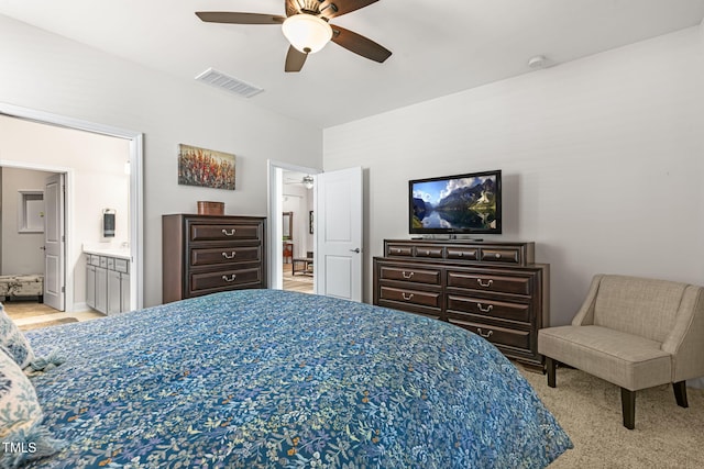 bedroom featuring ceiling fan and ensuite bath