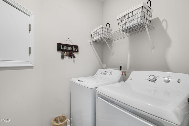 washroom featuring washer and clothes dryer