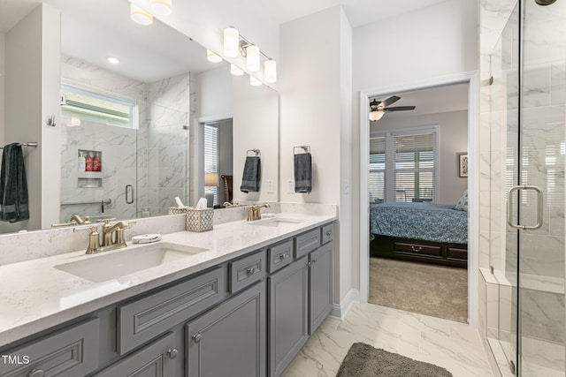 bathroom featuring ceiling fan, vanity, and a shower with shower door