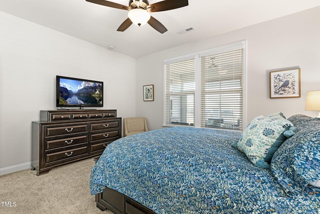 bedroom with light carpet and ceiling fan