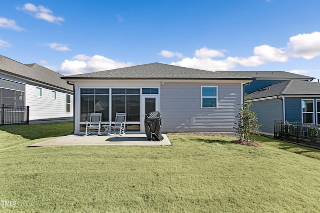 rear view of property with a patio area and a lawn