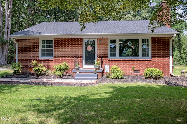 view of front of home with a front lawn