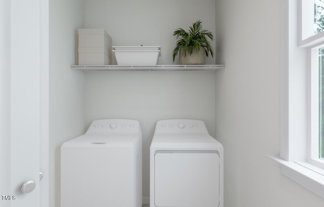 laundry room with independent washer and dryer