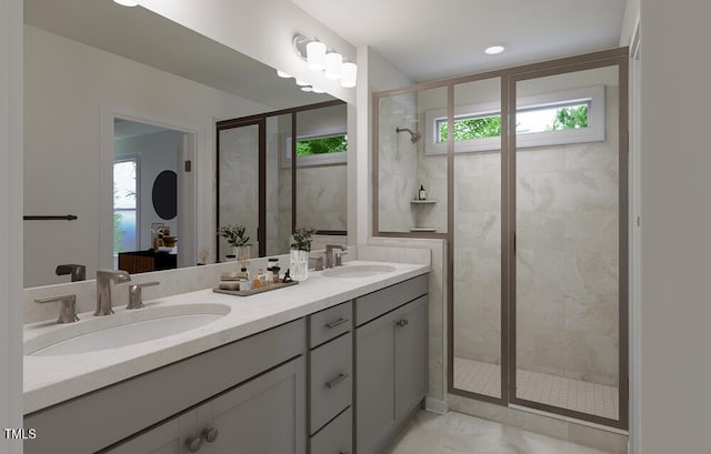 bathroom with a shower with shower door, tile patterned floors, and vanity