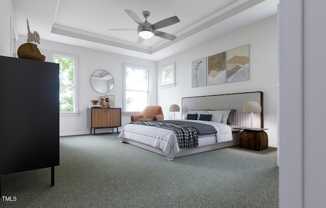 carpeted bedroom with ceiling fan and a raised ceiling