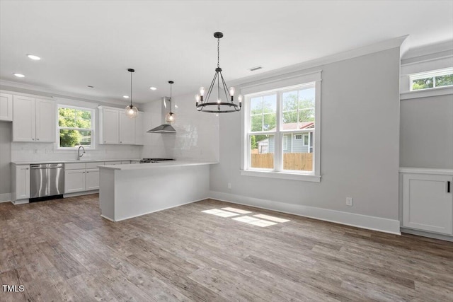 2905 Cammie St, Durham, NC 27705 - kitchen with dishwasher, wall chimney exhaust hood, a chandelier, white cabinets, and crown molding