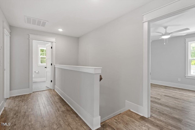 2905 Cammie St, Durham, NC 27705 - corridor featuring wood finished floors, healthy amount of natural light, an upstairs landing, and recessed lighting
