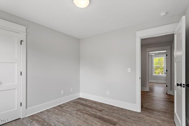 2905 Cammie St, Durham, NC 27705 - spare room featuring wood finished floors and a smoke detector