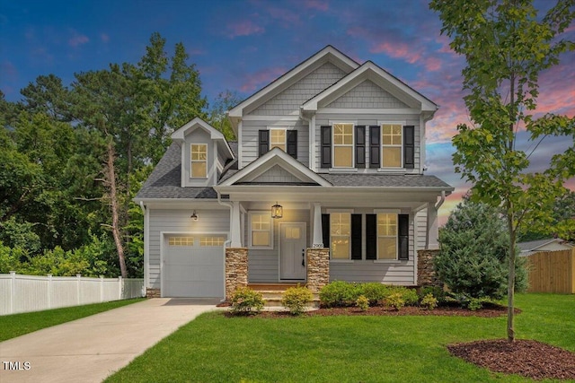 2905 Cammie St, Durham, NC 27705 - craftsman-style house featuring concrete driveway, stone siding, a porch, and a garage