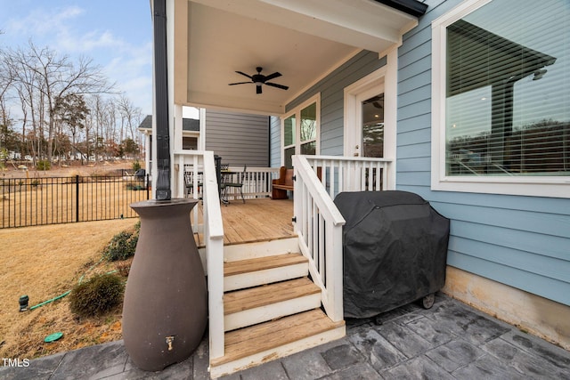 wooden deck featuring ceiling fan and grilling area