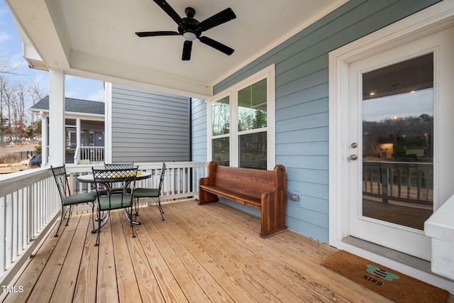 wooden deck with ceiling fan and covered porch