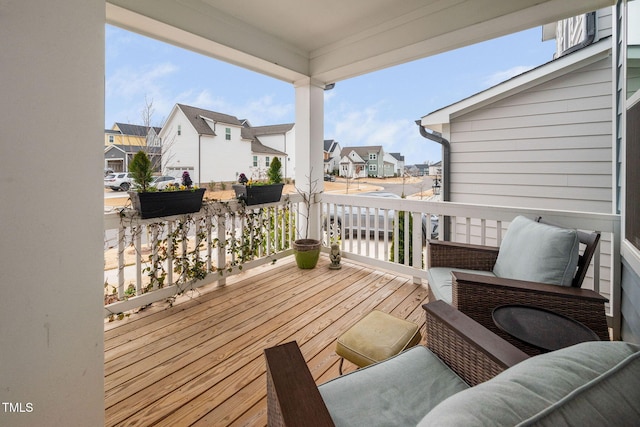 wooden terrace with a water view