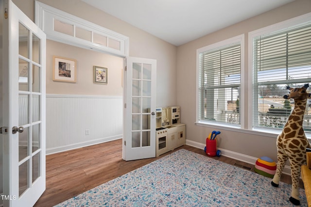 interior space featuring hardwood / wood-style floors and french doors