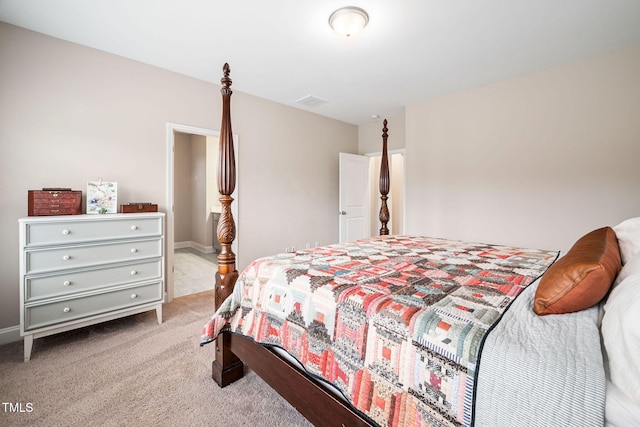 bedroom featuring light carpet