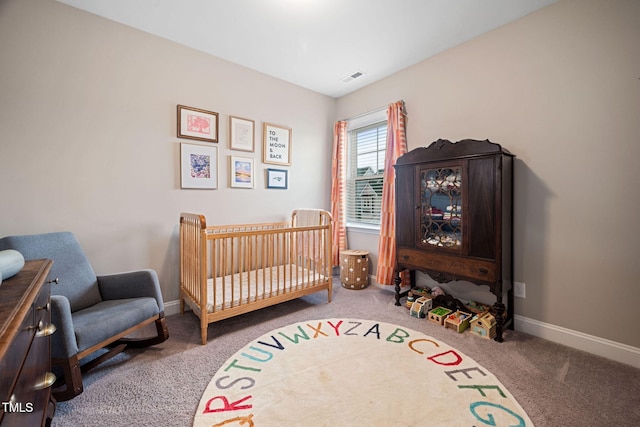 carpeted bedroom with a crib