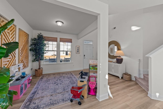 recreation room with light hardwood / wood-style flooring