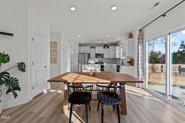 dining room featuring light hardwood / wood-style floors