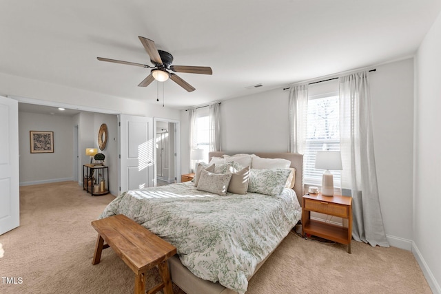 carpeted bedroom featuring ceiling fan