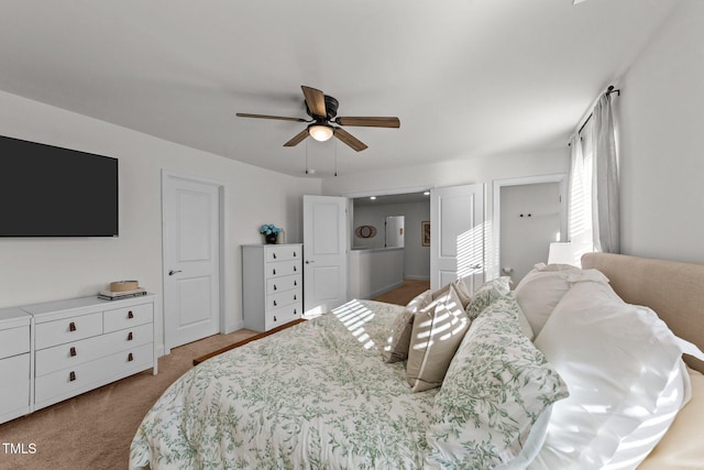 carpeted bedroom featuring ceiling fan