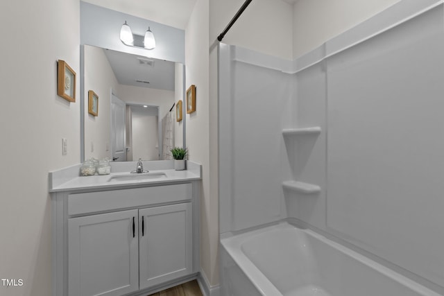 bathroom with vanity and shower / tub combination