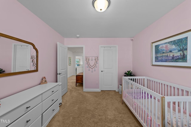 bedroom with light colored carpet and a crib