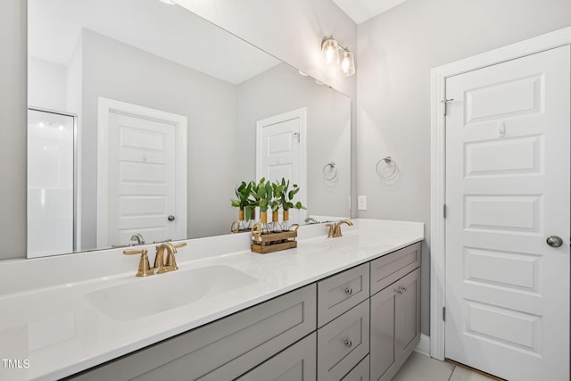 bathroom with tile patterned floors and vanity