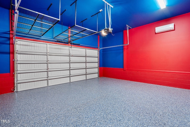 garage with a garage door opener and a wall unit AC