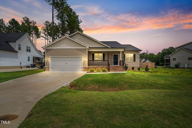 craftsman inspired home featuring a garage, a yard, and a porch