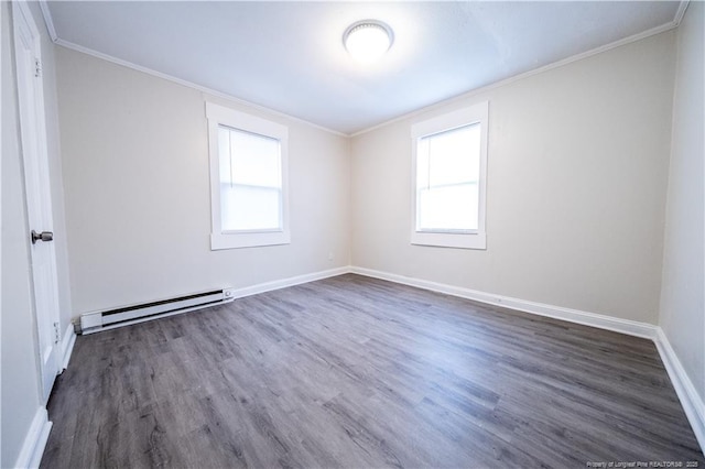 unfurnished room featuring a baseboard heating unit, dark hardwood / wood-style flooring, a wealth of natural light, and ornamental molding