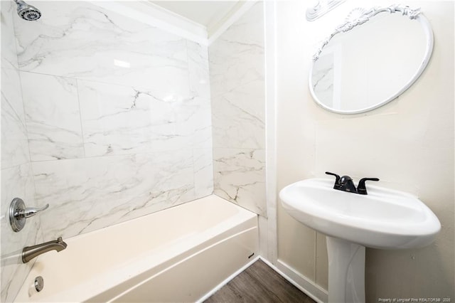 bathroom featuring tub / shower combination and hardwood / wood-style flooring