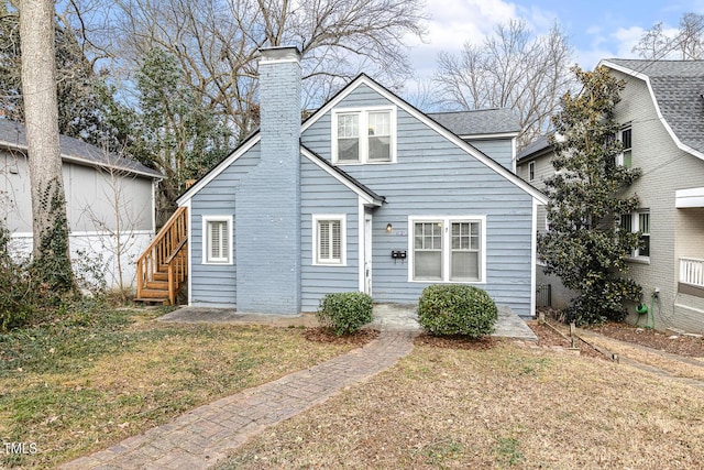 view of front of home with a front yard