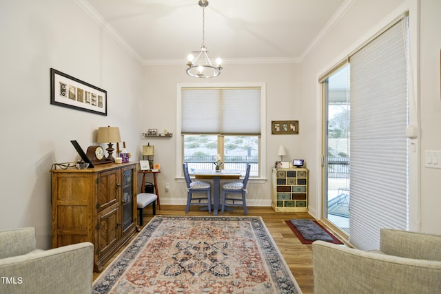 office with a chandelier, hardwood / wood-style flooring, a wealth of natural light, and ornamental molding