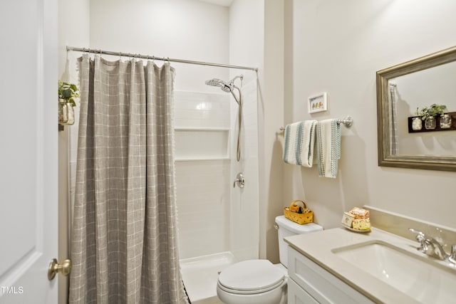 bathroom featuring vanity, toilet, and a shower with curtain