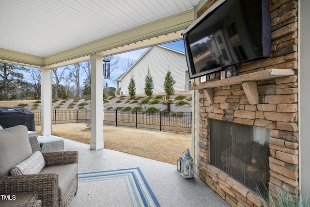 view of patio featuring grilling area and an outdoor stone fireplace