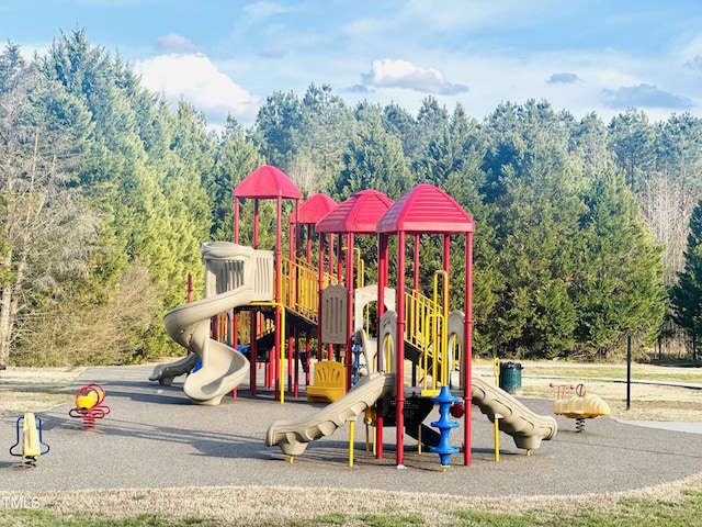 community playground with a view of trees