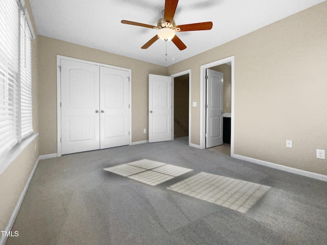 unfurnished bedroom featuring a closet, ceiling fan, light carpet, and multiple windows