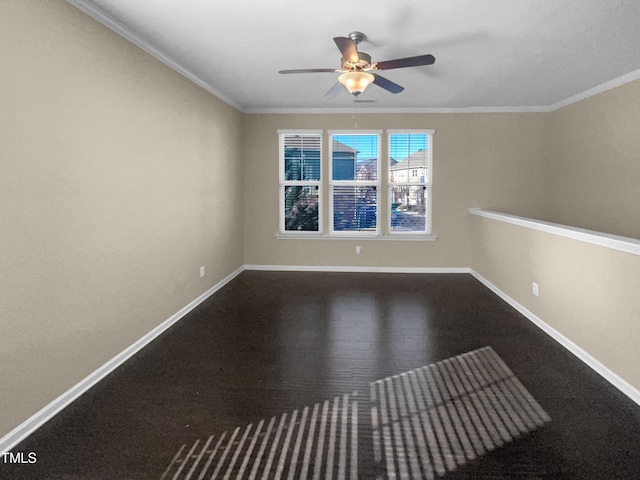 empty room featuring ceiling fan and ornamental molding