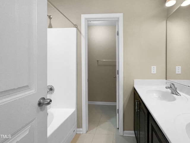 bathroom featuring vanity, bathtub / shower combination, and tile patterned flooring