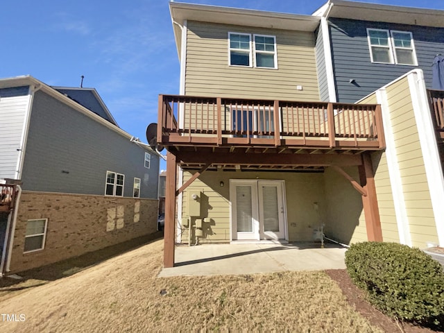 rear view of property with a patio area and a deck