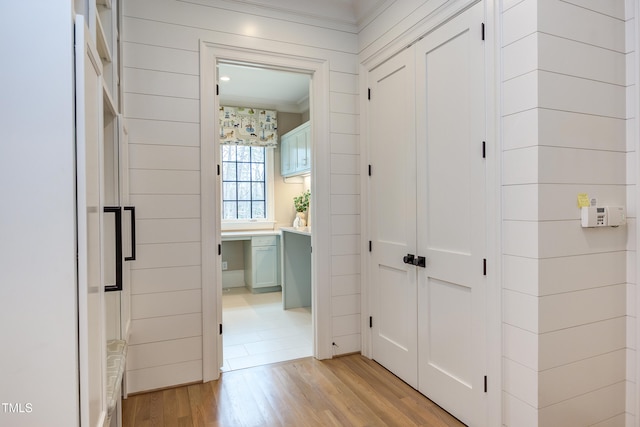 corridor featuring light hardwood / wood-style floors