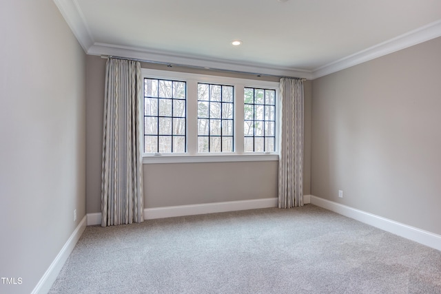 carpeted empty room featuring ornamental molding