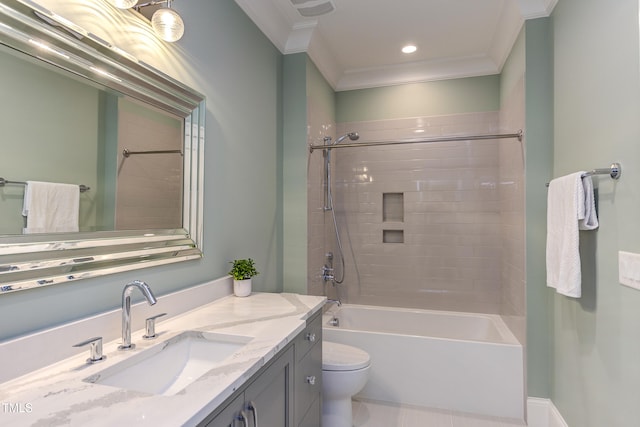 full bathroom with crown molding, tiled shower / bath, vanity, and toilet