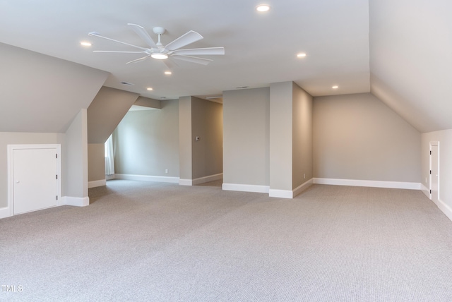 bonus room with light carpet, vaulted ceiling, and ceiling fan