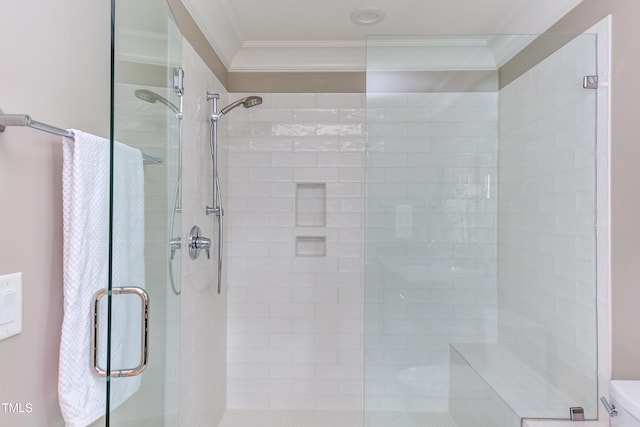 bathroom featuring an enclosed shower, crown molding, and toilet