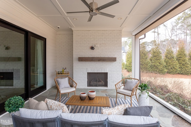 exterior space with an outdoor brick fireplace, ceiling fan, and coffered ceiling