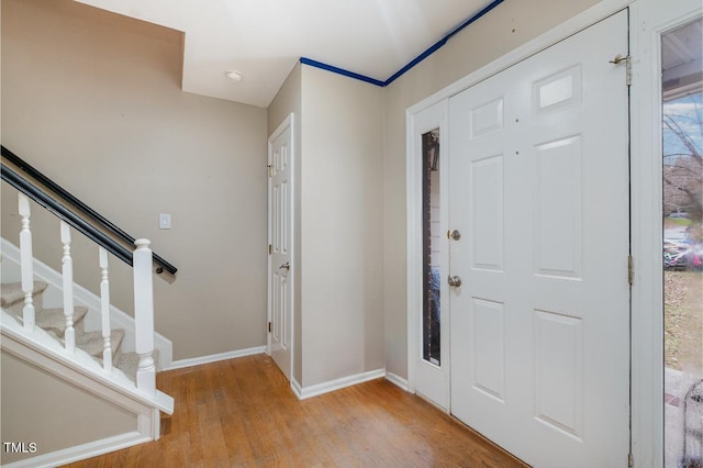 foyer with light hardwood / wood-style floors