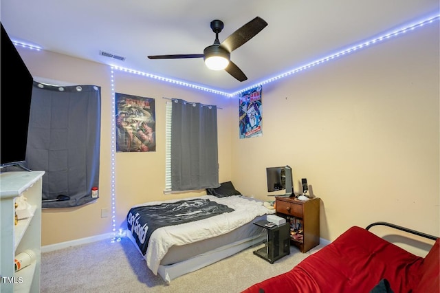 bedroom featuring light colored carpet and ceiling fan