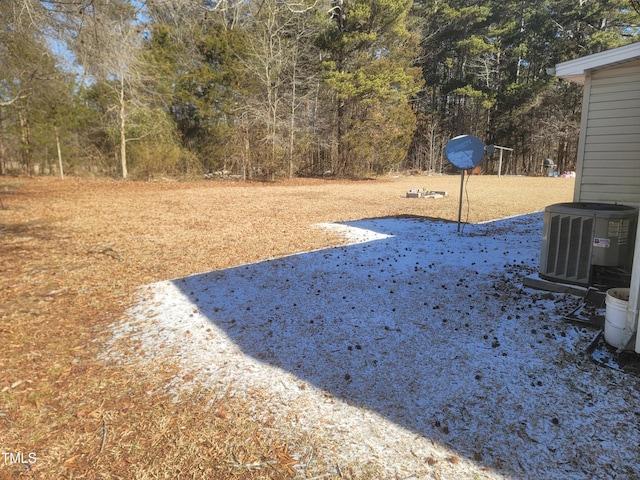 view of yard with central AC unit