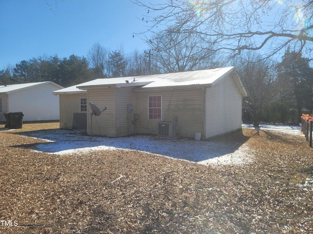 rear view of house featuring central AC unit