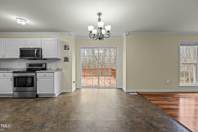 kitchen with stainless steel appliances, ornamental molding, white cabinets, and decorative backsplash